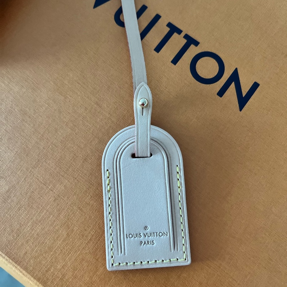 Authentic Louis Vuitton tag. Never used. Beige